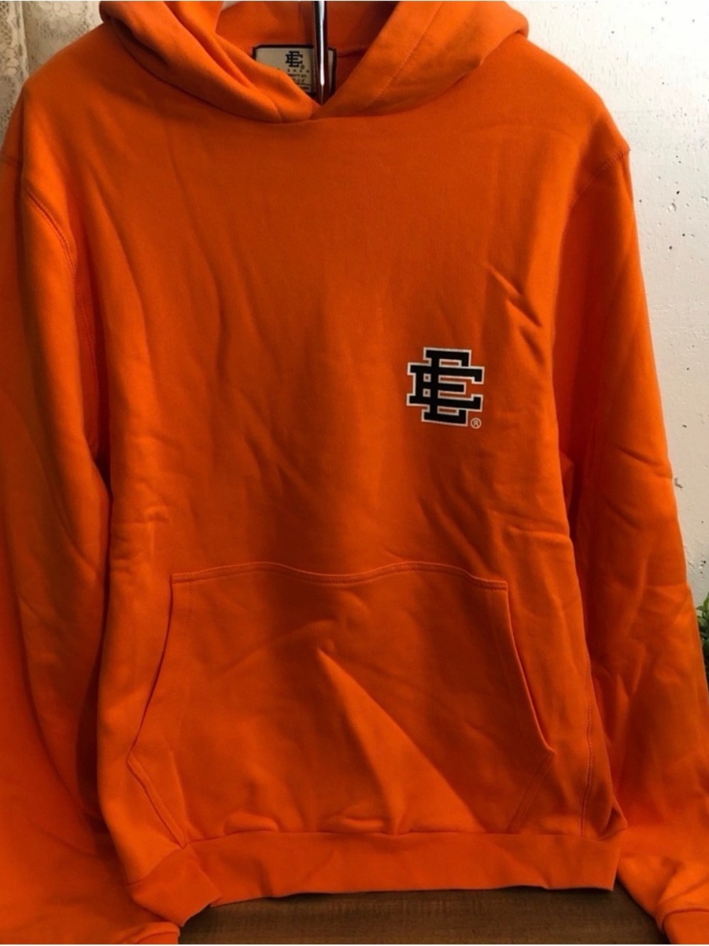 Eric Emanuel Orange Hoodie with Black/White Chest Logo